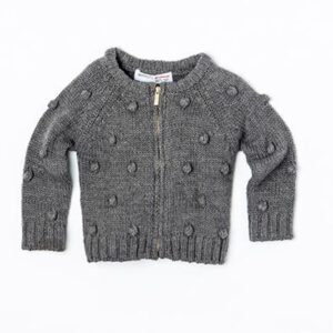 Svetr dívčí celopropínací s bambulkami